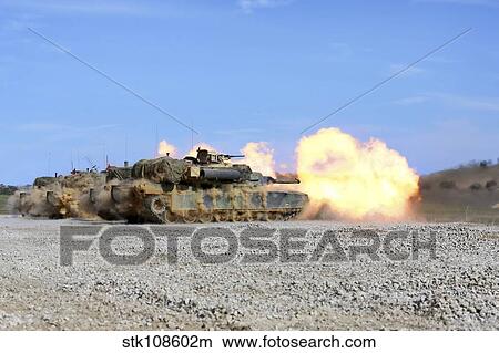 M1A1 Abrams fire their 120mm smoothbore cannon. View Large Photo Image Picture - M1A1 Abrams fire their 120mm smoothbore cannon.. Fotosearch