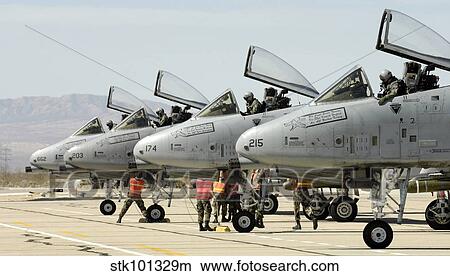 Maintainers perform pre-flight inspections on A-10 Thunderbolt II's. View Large Photo Image Picture - Maintainers perform pre-flight inspections on A-10 Thunderbolt II's.. Fotosearch