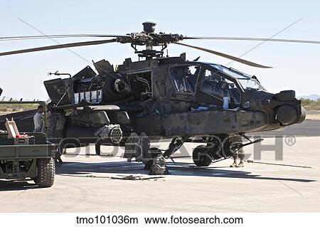 Picture - Maintenance being conducted on an AH-64D Apache Longbow.. Fotosearch