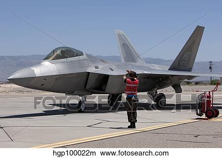 Maintenance crews perform preflight checks with F-22 Raptors. View Large Photo Image Picture - Maintenance crews perform preflight checks with F-22 Raptors.. Fotosearch