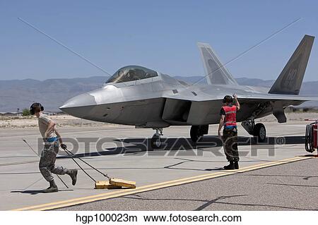 Maintenance crews perform preflight checks with F-22 Raptors. View Large Photo Image Picture - Maintenance crews perform preflight checks with F-22 Raptors.. Fotosearch