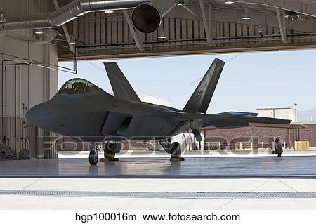 Maintence crews onduct preflight checks on an F-22 Raptor. View Large Photo Image Picture - Maintence crews onduct preflight checks on an F-22 Raptor.. Fotosearch