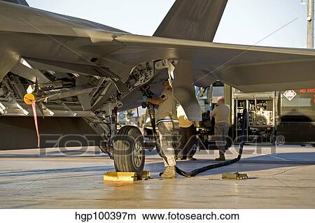 Maintence personnel prepare to refuel an F-22 Raptor. View Large Photo Image Picture - Maintence personnel prepare to refuel an F-22 Raptor.. Fotosearch