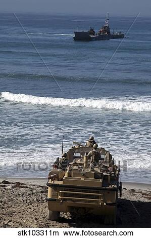 Marines anticipate the arrival of an Improved Navy Lighterage System. View Large Photo Image Picture - Marines anticipate the arrival of an Improved Navy Lighterage System.. Fotosearch