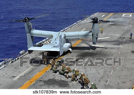 Marines board an MV-22 Osprey on the flight deck of USS Bonhomme Richard. View Large Photo Image Picture - Marines board an MV-22 Osprey on the flight deck of USS Bonhomme Richard.. Fotosearch