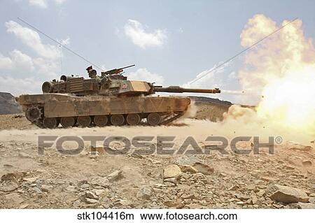 Marines bombard through a live fire range using M1A1 Abrams tanks. View Large Photo Image Picture - Marines bombard through a live fire range using M1A1 Abrams tanks.. Fotosearch