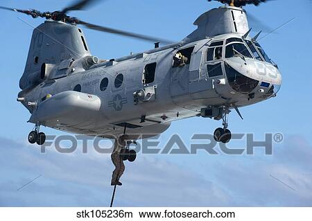 Marines fast rope from a CH-46 Sea Knight. View Large Photo Image Picture - Marines fast rope from a CH-46 Sea Knight.. Fotosearch