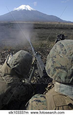 Picture - Marines fire an M2. 50 caliber machine gun.. Fotosearch