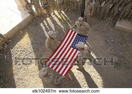 Marines fold an American flag. View Large Photo Image Picture - Marines fold an American flag.. Fotosearch