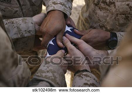 Marines fold an American flag. View Large Photo Image Picture - Marines fold an American flag.. Fotosearch