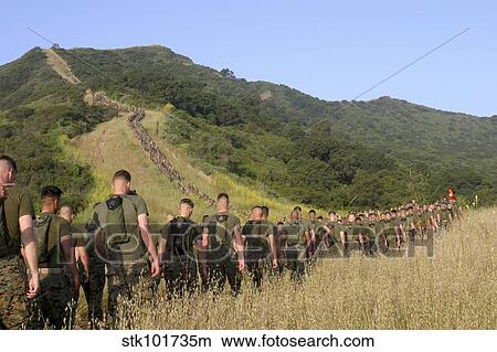 Marines hike their way to a memorial site set up just outside of Camp Horno. View Large Photo Image Picture - Marines hike their way to a memorial site set up just outside of Camp Horno.. Fotosearch