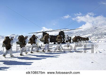Marines load a waiting CH-47 Chinook helicopter. View Large Photo Image Picture - Marines load a waiting CH-47 Chinook helicopter.. Fotosearch