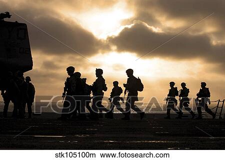 Marines move to a firing line on the flight deck of USS New Orleans. View Large Photo Image Picture - Marines move to a firing line on the flight deck of USS New Orleans.. Fotosearch