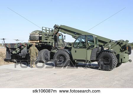 Marines pick up palletized logistics vehicle system tires. View Large Photo Image Picture - Marines pick up palletized logistics vehicle system tires.. Fotosearch