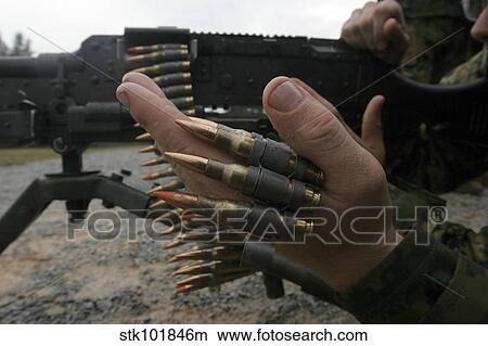 Marines prepare the M-240G medium machine gun with 7. 62 mm rounds. View Large Photo Image Picture - Marines prepare the M-240G medium machine gun with 7. 62 mm rounds.. Fotosearch