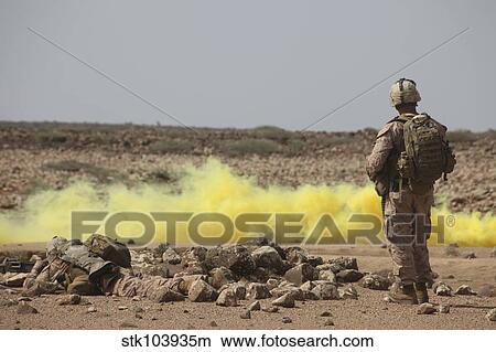 Marines provide security while smoke marks a landing zone. View Large Photo Image Picture - Marines provide security while smoke marks a landing zone.. Fotosearch