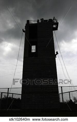 Marines rappel from the Camp Hansen Rappel Tower. View Large Photo Image Picture - Marines rappel from the Camp Hansen Rappel Tower.. Fotosearch