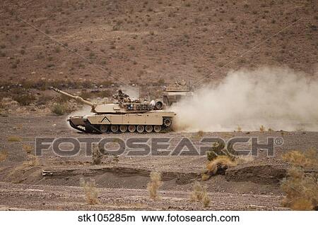 Marines roll through the Combat Center training area during a patrol. View Large Photo Image Picture - Marines roll through the Combat Center training area during a patrol.. Fotosearch