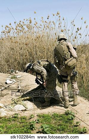 Marines search for weapons caches. View Large Photo Image Picture - Marines search for weapons caches.. Fotosearch
