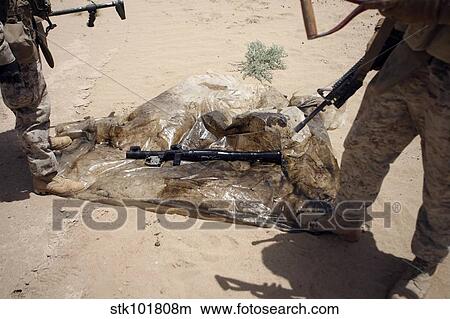 Marines stand over a rocket-propelled grenade launcher. View Large Photo Image Picture - Marines stand over a rocket-propelled grenade launcher.. Fotosearch