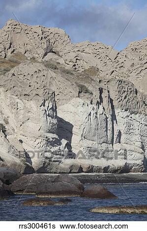 Massive weathered tuff deposits along the south coast of Santorini, Greece. View Large Photo Image Stock Photograph - Massive weathered tuff deposits along the south coast of Santorini, Greece.. Fotosearch