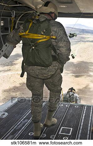 Members of the 820th Red Horse squadron jump from a CH-47 Chinook View Large Photo Image Picture - Members of the 820th Red Horse squadron jump from a CH-47 Chinook. Fotosearch