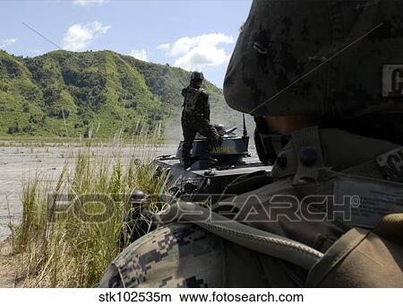 Members of the Philippine Armed Forces fire the weapons systems of a light armored vehicle 300. View Large Photo Image Picture - Members of the Philippine Armed Forces fire the weapons systems of a light armored vehicle 300.. Fotosearch