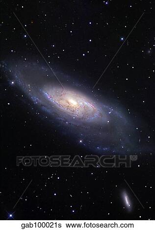 Messier 106, a spiral galaxy in the constellation Canes Venatici View Large Photo Image Stock Photograph - Messier 106, a spiral galaxy in the constellation Canes Venatici. Fotosearch