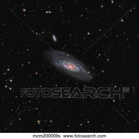Messier 106, a spiral galaxy in the constellation Canes Venatici. View Large Photo Image Stock Photograph - Messier 106, a spiral galaxy in the constellation Canes Venatici.. Fotosearch