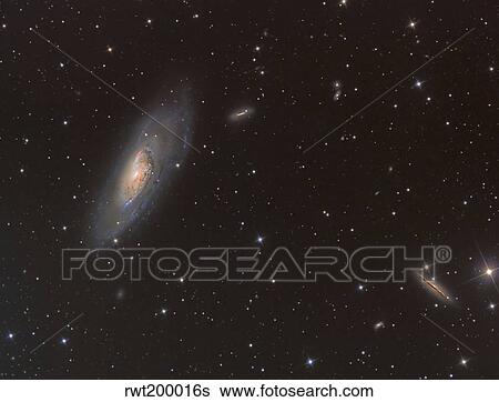 Messier 106 spiral galaxy in the constellation Canes Venatici. View Large Photo Image Stock Photograph - Messier 106 spiral galaxy in the constellation Canes Venatici.. Fotosearch