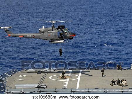 Mexican Military Commandos rappel onto a German combat support ship. View Large Photo Image Picture - Mexican Military Commandos rappel onto a German combat support ship.. Fotosearch