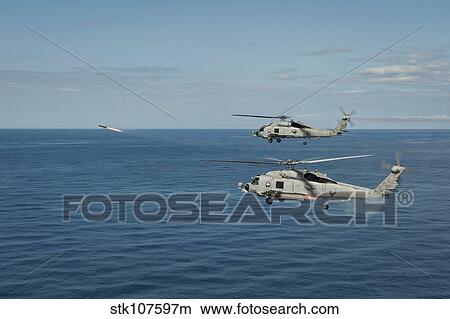 MH-60R Sea Hawk helicopters launch AGM-114 hellfire missiles. View Large Photo Image Picture - MH-60R Sea Hawk helicopters launch AGM-114 hellfire missiles.. Fotosearch