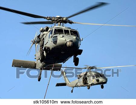 Picture - MH-60S Sea Hawk helicopters in flight.. Fotosearch