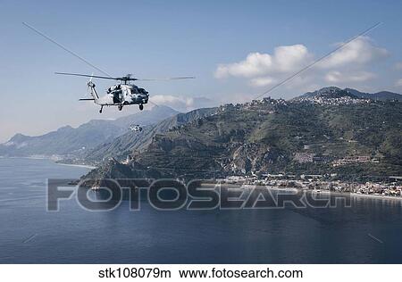 MH-60S Sea Hawk helicopters off the coast of Naples, Italy. View Large Photo Image Picture - MH-60S Sea Hawk helicopters off the coast of Naples, Italy.. Fotosearch