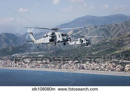 MH-60S Sea Hawk helicopters off the coast of Naples, Italy. View Large Photo Image Picture - MH-60S Sea Hawk helicopters off the coast of Naples, Italy.. Fotosearch
