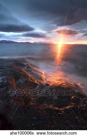 Stock Photograph - Midnight Sun over Vagsfjorden, Skanland, Troms County, Norway. Fotosearch