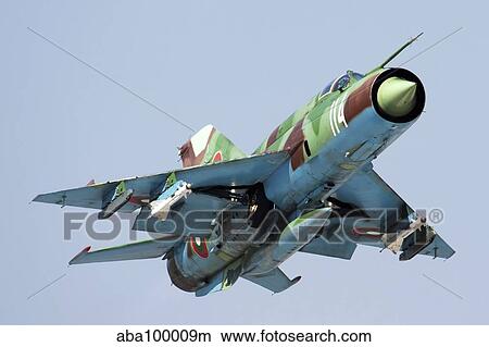 MiG-21bis taking off armed with AA-8 Aphid air-to-air missiles. View Large Photo Image Picture - MiG-21bis taking off armed with AA-8 Aphid air-to-air missiles.. Fotosearch