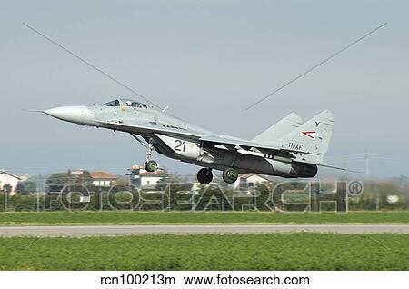 MiG-29 Fulcrum from the Hungarian Air Force taking off from Cervia Air Base, Italy. View Large Photo Image Picture - MiG-29 Fulcrum from the Hungarian Air Force taking off from Cervia Air Base, Italy.. Fotosearch