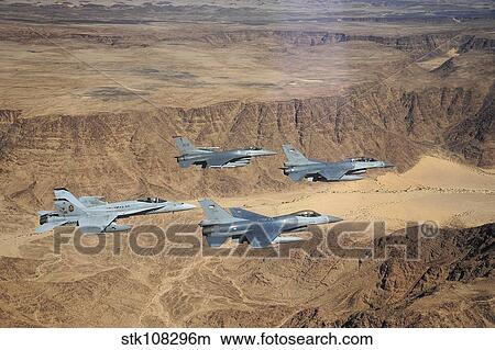Picture - Military planes flying over the Wadi Rum desert in Jordan.. Fotosearch