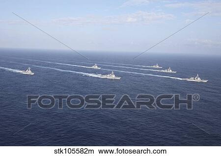 Military ships transit the Philippine Sea in formation. View Large Photo Image Picture - Military ships transit the Philippine Sea in formation.. Fotosearch