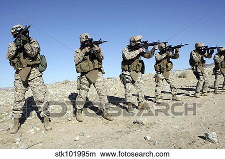 Military Transistion Team members quickly reload their rifles. View Large Photo Image Picture - Military Transistion Team members quickly reload their rifles.. Fotosearch