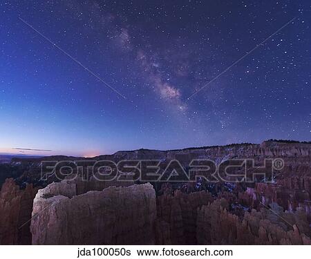 Milky Way over the needle rock formations of Bryce Canyon, Utah. View Large Photo Image Stock Photograph - Milky Way over the needle rock formations of Bryce Canyon, Utah.. Fotosearch