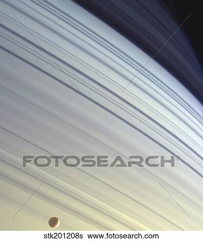 Mimas drifts along in its orbit against the azure backdrop of Saturn's northern latitudes. View Large Photo Image Stock Photograph - Mimas drifts along in its orbit against the azure backdrop of Saturn's northern latitudes.. Fotosearch