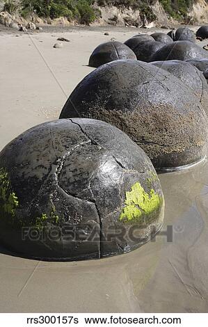 Stock Photograph - Moeraki Boulders, Koekohe Beach, New Zealand.. Fotosearch