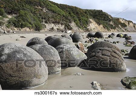 Stock Photograph - Moeraki Boulders, Koekohe Beach, New Zealand.. Fotosearch
