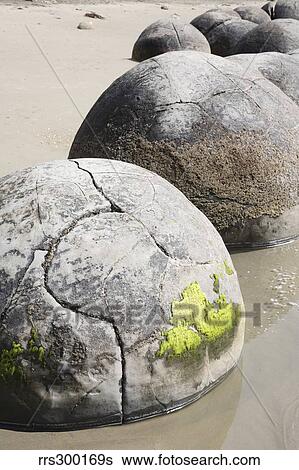 Stock Photograph - Moeraki Boulders, Koekohe Beach, New Zealand.. Fotosearch