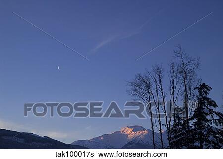 Moon and Alpenglow. View Large Photo Image Stock Photograph - Moon and Alpenglow.. Fotosearch