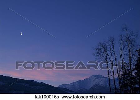 Moon at dawn. View Large Photo Image Stock Photograph - Moon at dawn.. Fotosearch