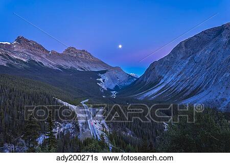 Moon over Icefields Parkway in Alberta, Canada. View Large Photo Image Stock Photograph - Moon over Icefields Parkway in Alberta, Canada.. Fotosearch