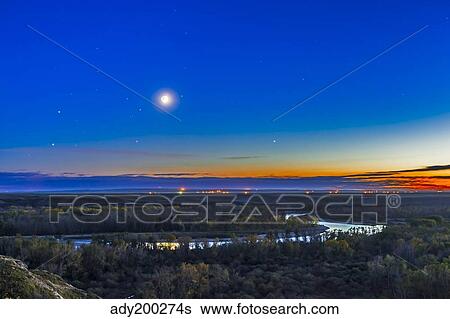 Moon with Antares, Mars and Saturn over Bow River in Alberta, Canada. View Large Photo Image Stock Photograph - Moon with Antares, Mars and Saturn over Bow River in Alberta, Canada.. Fotosearch